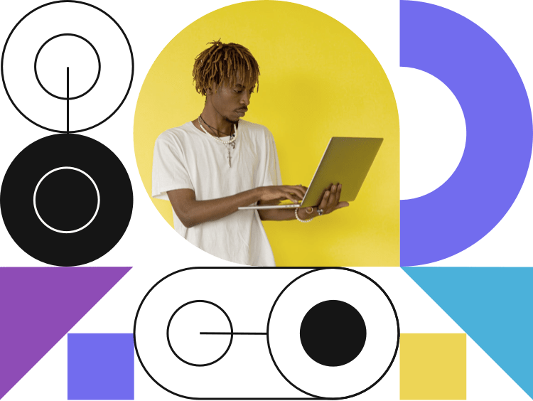 a black man with dreads operating a laptop